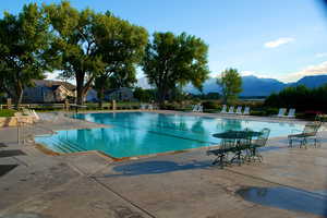 Pool featuring a patio area and a mountain view