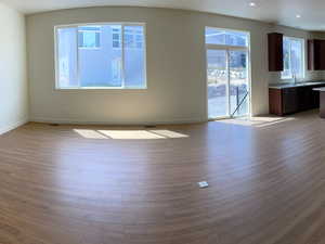 Interior space featuring baseboards and wood finished floors