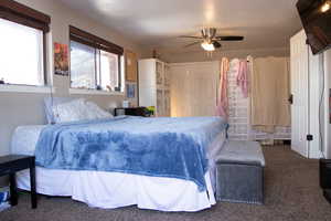 Bedroom on 2nd floor featuring a ceiling fan, carpet, and a textured ceiling