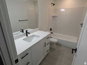 Full bath with shower / bathtub combination, toilet, and vanity