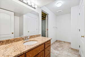 Basement Bathroom with walk in shower and storage closet. With a possibility for an en suite bedroom