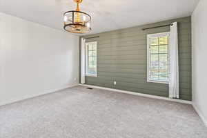 Primary bedroom featuring accent wall