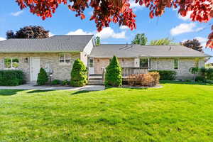 Ranch-style home with garage to yard side entrance
