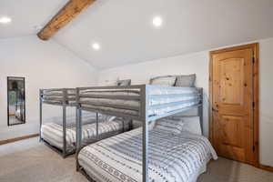 Bedroom featuring carpet floors, recessed lighting, vaulted ceiling with beams, and baseboards