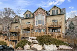 Exterior space with stone siding and french doors