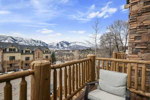 Wooden terrace featuring a mountain view