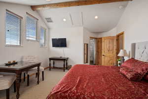 Carpeted bedroom with lofted ceiling with beams, recessed lighting, visible vents, and baseboards