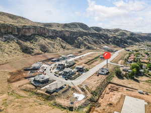 Birds eye view of property with a mountain view