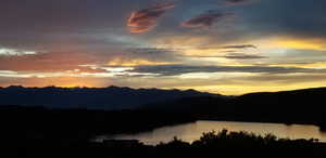 Property view of mountains featuring a water view