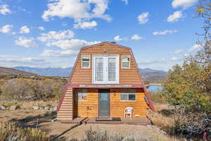 View of front of property featuring a mountain view and a gambrel roof