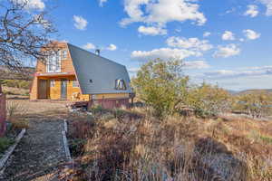 Rear view of house with a gambrel roof