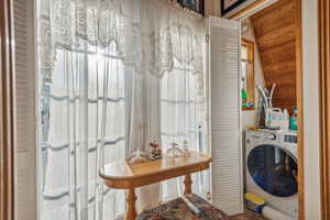 Clothes washing area with laundry area and washer / dryer