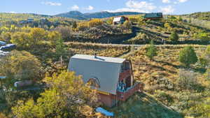 Bird's eye view featuring a mountain view and a view of trees