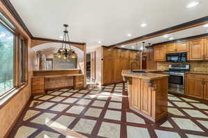 Well designed kitchen with Hickory Cabinets and Breakfast Bar