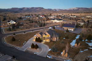 Birds eye view of property featuring a mountain view and a residential view