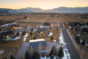 Aerial view at dusk with a residential view and a mountain view