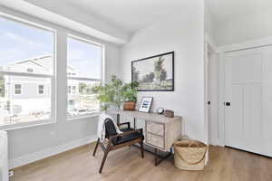 Home office featuring wood finished floors and baseboards