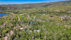 View of property location featuring a water and mountain view