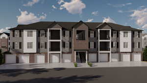 View of property with brick siding, a residential view, and an attached garage