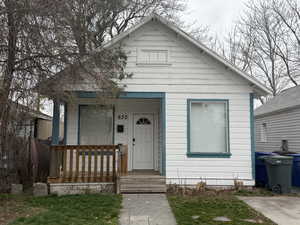 Bungalow featuring covered porch