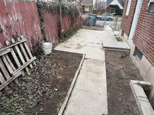 View of yard with a gate and fence