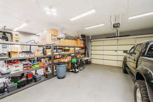 Garage featuring a garage door opener