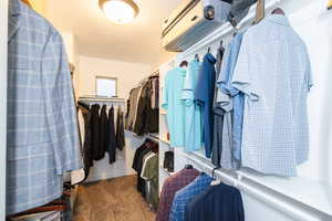 Walk in closet featuring carpet flooring