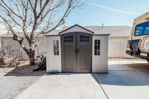 View of shed with fence