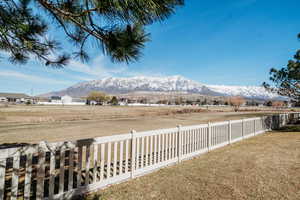 Property view of mountains with a rural view