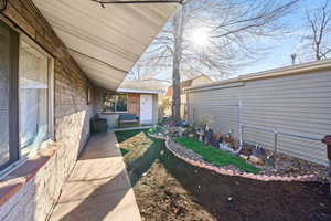 View of yard featuring fence