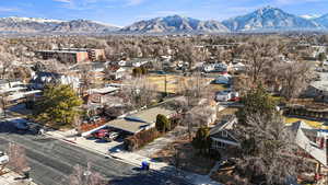 Birds eye view of property with a residential view and a mountain view