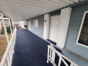 View of patio / terrace with grilling area and a balcony