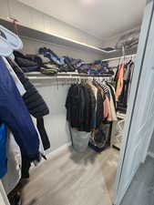 Spacious closet with wood finished floors