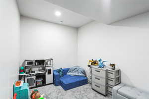 Playroom with visible vents and carpet floors