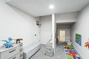 Rec room featuring carpet flooring and baseboards