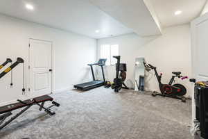 Workout area featuring recessed lighting, baseboards, and carpet floors
