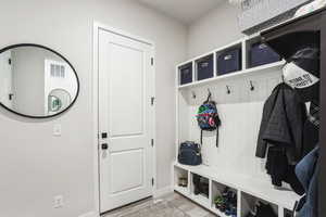 Mudroom featuring visible vents and light wood-style flooring