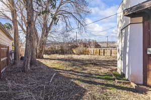 View of yard with fence