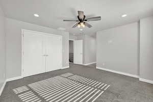Master Bedroom featuring recessed lighting, carpet flooring, a ceiling fan, and a closet