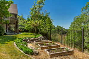 View of yard with stairs and a garden