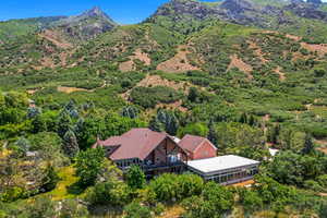 View from above of property with a mountain backdrop