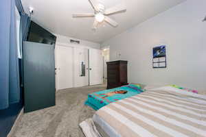 Bedroom featuring a ceiling fan, a closet, carpet flooring, and visible vents