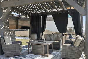 View of patio featuring a pergola and an outdoor hangout area