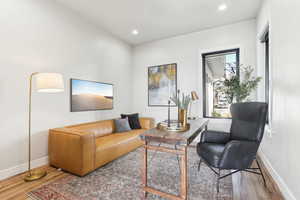 Living room featuring recessed lighting, baseboards, and wood finished floors