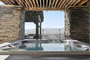 Exterior space featuring a mountain view and a hot tub