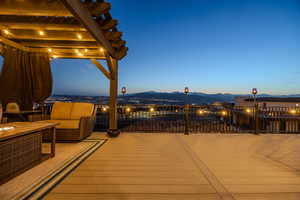 View of patio / terrace with a mountain view and a pergola
