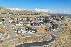 Birds eye view of property with a mountain view and a residential view
