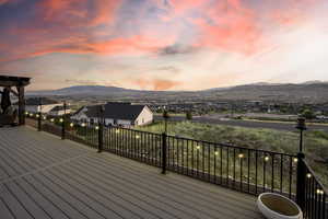 Deck with a mountain view and a residential view