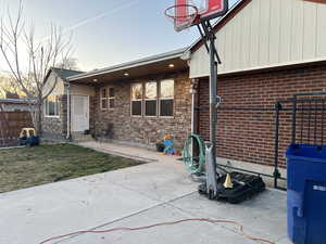 Back of home - covered porch with lights.  concrete is in great shape