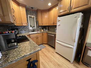 Kitchen with granite and custom tall cabinets maximizing storage